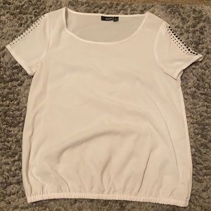 I’m selling a white blouse from the brand a.n.a
